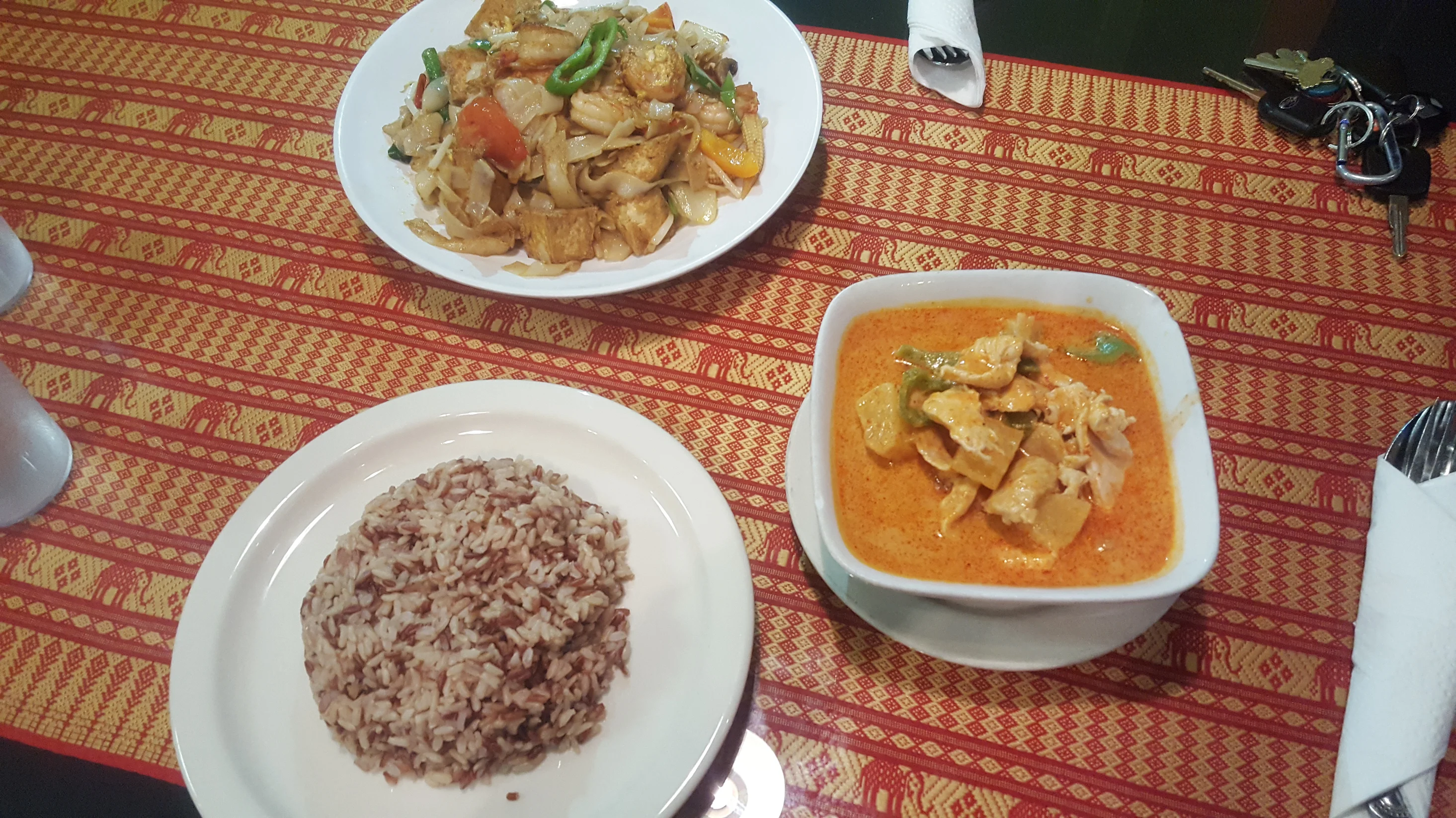 Table spread with multiple Thai dishes